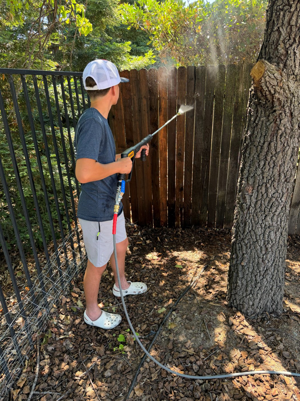 Harrison Cable pressure washing a fence in Rocklin, CA
