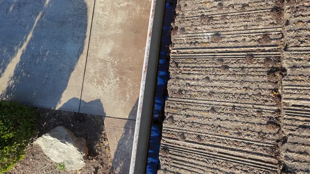 Cleaned rain gutter and clear channel after gutter cleaning on a Placer County home