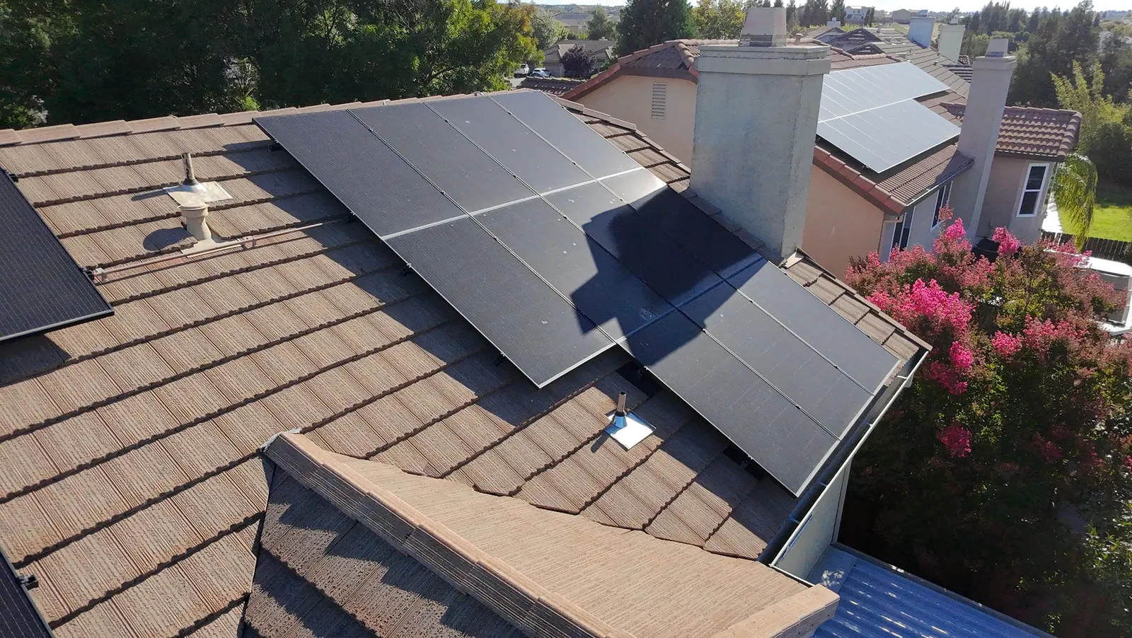 Roof-mounted solar panels on a concrete tile roof, the most common solar setup Cable cleans in Rocklin CA